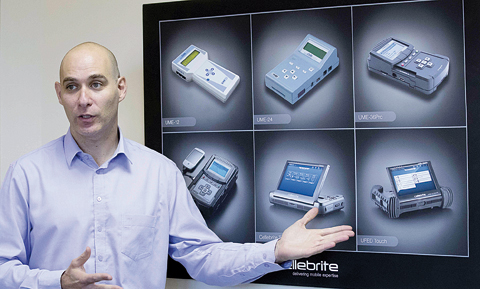 PETAH TIKVA, Israel : Leeor Ben-Peretz, the Executive Vice President of the Israeli firm Cellebrite’s technology, shows devices and explains the technology developed by his company on November 9, 2016. —AFP