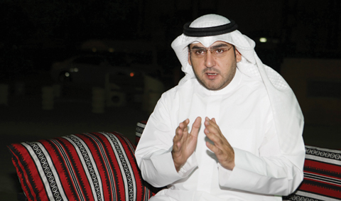 KUWAIT: Third constituency candidate Abdulkareem Al-Kandari speaks to Kuwait Times. —Photo by Joseph Shagra
