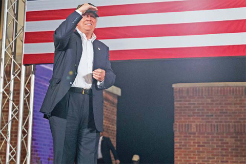 PENSACOLA, FLORIDA: Republican presidential candidate Donald Trump looks at the crowd as he arrives to a campaign rally on Wednesday. — AP