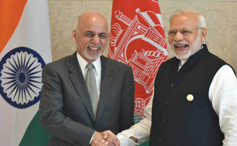 AMRITSAR: Indian Prime Minister Narendra Modi (R) shakes hands with Afghan President Ashraf Ghani (L) during the 6th Heart of Asia (HoA) Ministerial Conference. — AFP