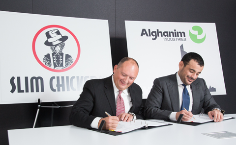 Tom Gordon and Omar Alghanim signing the contract