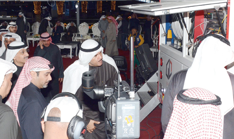 Information Minister Sheikh Salman Al-Humoud Al- Sabah checks one of the new vehicles