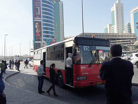 KUWAIT: This undated file photo shows commuters take a public transportation bus in Kuwait City.