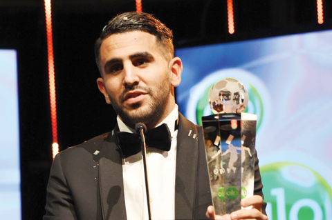 ABUJA: File photo shows Algerian and Leicester forward Riyad Mahrez holds a trophy after being crowned African Footballer of the Year in Abuja, on January 5, 2017. – AFP