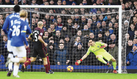  LIVERPOOL: Manchester City's Chilean goalkeeper Claudio Bravo puts out a hand but cannot stop Everton's Belgian striker Kevin Mirallas's shot beating him for their second goal during the English Premier League football match between Everton and Manchester City at Goodison Park in Liverpool, north-west England yesterday. - AFP