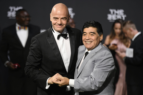 Gianni Infantino, left, FIFA President, and Diego Armando Maradona, a former  Argentine  footballer, pose for a photo on the greenncarpet while arriving for the The Best FIFA Football Awards 2016 ceremony  in Zurich, Switzerland, Monday, Jan. 9, 2017.  (WalternBieri/Keystone via AP)