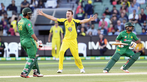 MELBOURNE: Australia's Josh Hazlewood (C) appeals for an LBW decision against Pakistan batsman Mohammad Hafeez (R) as fellow batsman Sharjeel Khan (L) looks on during their one-day international (ODI) cricket match at the MCG in Melbourne yesterday. – AFP