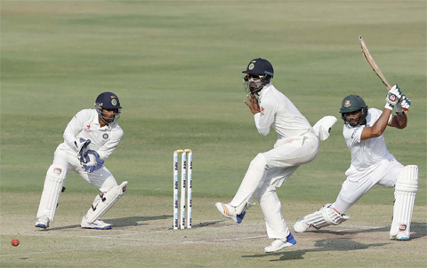 HYDERABAD: India’s wicketkeeper Wriddhiman Saha, left, and Lokesh Rahul, center, react after Bangladesh’s Mahmudullah, right, plays a shot during the fourth day of the cricket Test match in Hyderabad, India, yesterday. —AP