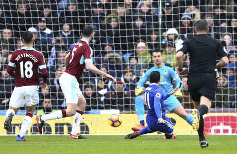 BURNLEY: Chelsea's Pedro, centre, scores his side's first goal during the English Premier League soccer match between Burnley and Chelsea at Turf Moor stadium in Burnley, England, yesterday. - AP