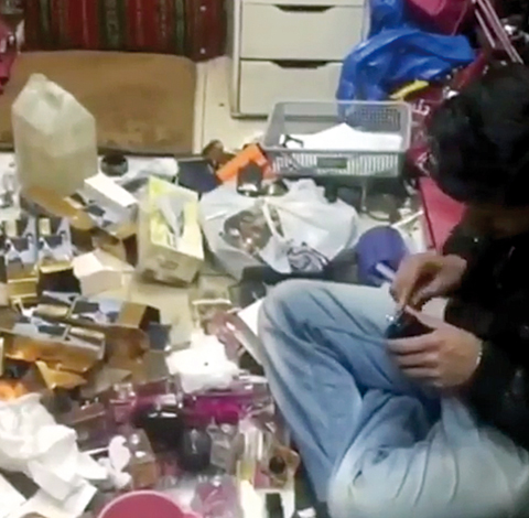 KUWAIT: A photo circulated on social media allegedly showing a man filling bottles with counterfeit perfume.