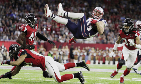 HOUSTON: New England Patriots’ Julian Edelman is upended by Atlanta Falcons’ Philip Wheeler, during the first half of the NFL Super Bowl 51 football game Sunday, in Houston. — AP