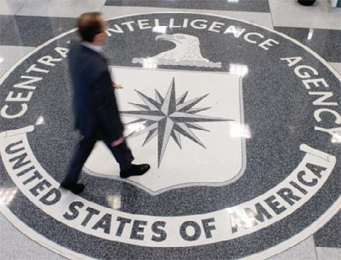 LANGLEY: This file photo shows a man walking over the seal of the Central Intelligence Agency (CIA) in the lobby of CIA Headquarters in Langley, Virginia. — AP