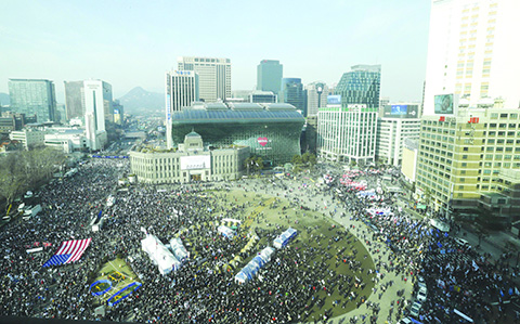 Supporters of impeached South Korean President Park Geun-hye stage a rally opposing her impeachment in Seoul, South Korea, Saturday, March 11, 2017. South Korean police on Saturday braced for more violence between opponents and supporters of ousted President Park Geun-hye, who was stripped of her powers by the Constitutional Court over a corruption scandal that has plunged the country into a political turmoil. (AP Photo/Ahn Young-joon)