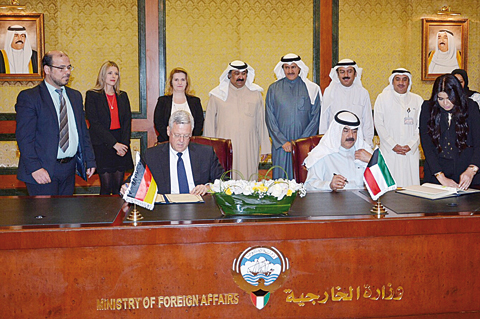 KUWAIT: Deputy Foreign Minister Khaled Al-Jarallah and the Ambassador of Germany to Kuwait Karlfried Bergner sign a visa-exemption agreement yesterday. —KUNA