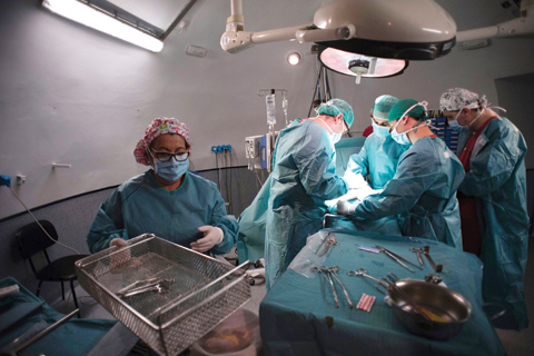MADRID: Surgeon Mario Alvarez Maestro (2nd left) and his staff perform a renal transplantation on patient Juan Benito Druet at La Paz hospital in Madrid.