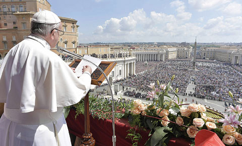 VATICAN: This handout picture released by the Vatican press office shows Pope Francis during the “Urbi et Orbi” blessing for Rome and the world from the central loggia of St Peters’ basilica following the Easter Sunday mass. —AFP