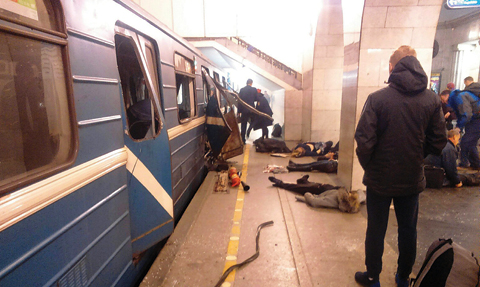 ST PETERSBURG, Russia: Blast victims lie near a subway train hit by an explosion at the Tekhnologichesky Institut subway station yesterday. - AP 