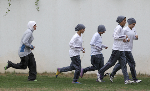 RIYADH: Members of a Saudi female soccer team practice at a secret location in Riyadh, Saudi Arabia. – AP 