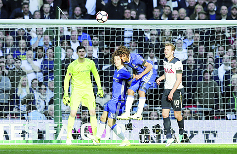 Chelsea's Nathan Ake, 2nd right, heads the ball away from Tottenham's Harry Kane, right, during the English FA Cup semifinal soccer match between Chelsea and Tottenham Hotspur at Wembley stadium in London, Saturday, April 22, 2017. (AP Photo/Tim Ireland)