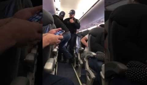 Image made from a video provided shows a passenger being removed from a United Airlines flight in Chicago. — AP