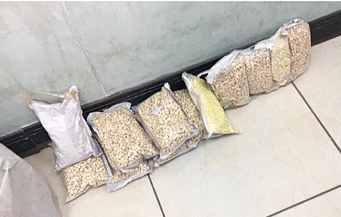 KUWAIT: Plastic bags containing drug pills that truck drivers tried to smuggle into Kuwait yesterday.