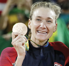 RIO DE JANEIRO: In this Aug. 18, 2016, file photo, United States’ Kerri Walsh Jennings stands on the podium after winning the bronze medal in the women’s beach volleyball competition of the 2016 Summer Olympics in Rio de Janeiro, Brazil. More than 100 athletes from around the world say the medals they won at the Rio Olympics are damaged. The IOC and Rio organizers plan to replace them with new medals. Among those with defective medals are beach volleyball star Kerri Walsh Jennings who says her bronze medal from last summer is flaking and rusting. — AP