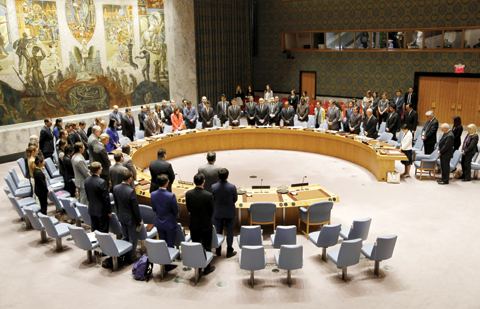 NEW YORK: Members of the United Nations Security Council observe a moment of silence for the victims of the terrorist attack in Manchester, England, before a meeting at UN headquarters, yesterday. — AP/AFP photos