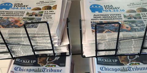  In this Monday, April 25, 2016, file photo, USA Today, Chicago Tribune and other newspapers are displayed at Chicago's O'Hare International Airport, in Chicago. A little more than half of American adults regularly pay for news, through newspaper and magazine subscriptions, apps on electronic devices or contributions to public media, according to the Media Insight Project released Tuesday, May 2, 2017, a collaboration between the American Press Institute and The Associated Press-NORC Center for Public Affairs Research. (AP Photo/Kiichiro Sato, File)