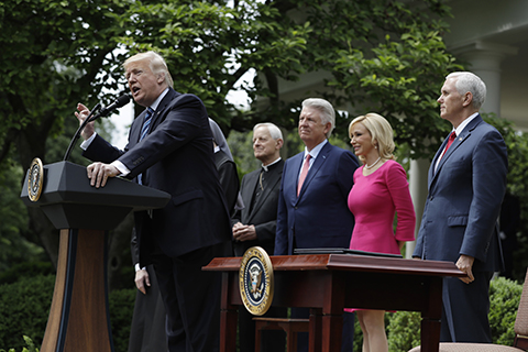 WASHINGTON: US President Donald Trump speaks in the Rose Garden of the White House on Thursday, before signing an executive order aimed at easing an IRS rule limiting political activity for churches. - AP n