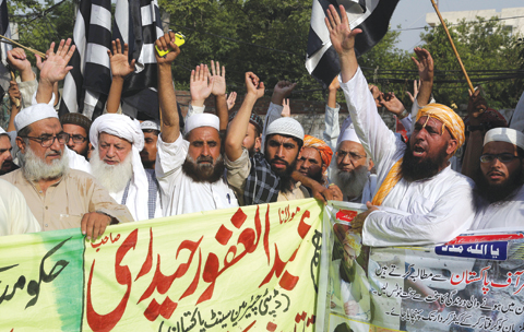 LAHORE: Supporters of Jamiat-e-Ulema Islam, a Pakistani religious group, chant slogans during a demonstration to condemn the Friday’s suicide bombing, in Lahore, Pakistan.—AP