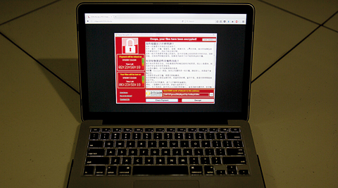 BEIJING: A screenshot of the warning screen from a purported ransomware attack, as captured by a computer user in Taiwan, is seen on laptop in Beijing. —AP