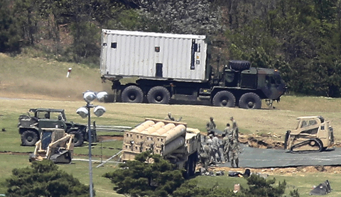 In this April 27, 2017 file photo, US Army soldiers install the missile defense system called Terminal High-Altitude Area Defense, or THAAD, at a golf course in Seongju, South Korea. — AP