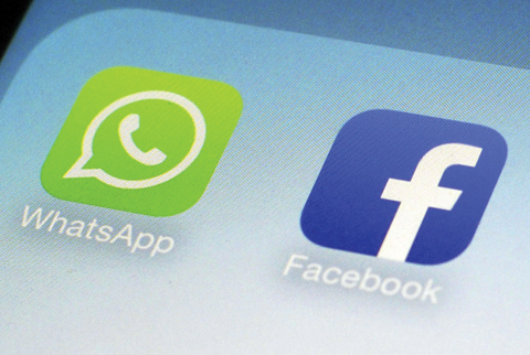 WhatsApp and Facebook app icons on a smartphone in New York. — AP