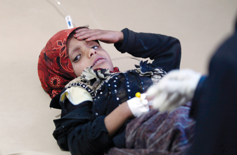 SANAA: A Yemeni child, suspected of being infected with cholera, receives treatment at a hospital in Sanaa. — AFP