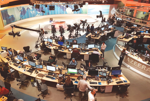 DOHA: In this June 8, 2017 photo, Al-Jazeera staff work at the TV station.— AP