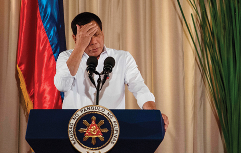 MANILA : This file photo taken on June 01, 2017 shows Philippine President Rodrigo Duterte gesturing as he gives a speech during the mass oath taking of officials of various national leagues at the Malacanang Palace in Manila.—AFP