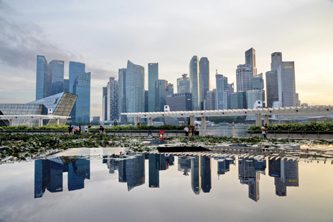 SINGAPORE: This photograph taken on Wednesday shows the sunset over the skyline of Singapore. —AFP
