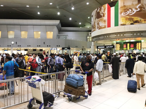 KUWAIT: Travelers at Kuwait International Airport. — KUNA