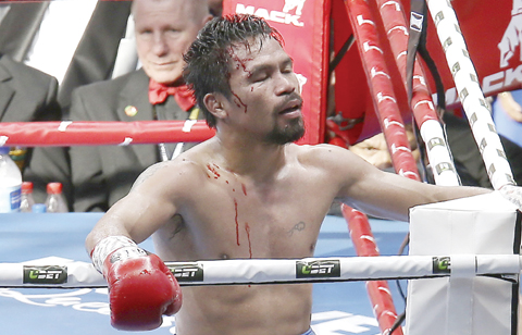 BRISBANE: Manny Pacquiao of the Philippines reacts after his loss to Jeff Horn of Australia, during their WBO World Welterweight title fight in Brisbane, Australia, Sunday. —AP