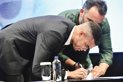 ISTANBUL: Portuguese defender Pepe signs his new contract with Besiktas yesterday at Vodafone Park stadium in Istanbul. — AFP