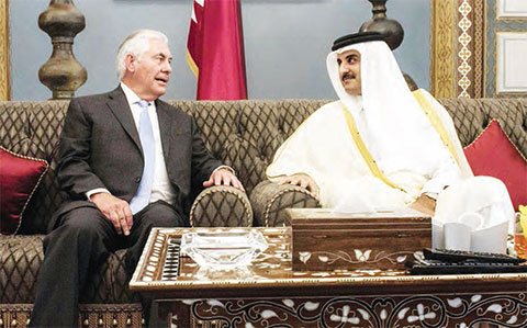 DOHA: US Secretary of State Rex Tillerson (left) meets Qatar’s Emir Sheikh Tamim bin Hamad Al-Thani at the Sea Palace residence yesterday. — AFP