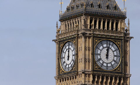 Two of the four faces of the Great Clock of the Elizabeth Tower, commonly referred to as Big Ben, are pictured at the Houses of Parliament in central London.-AFP