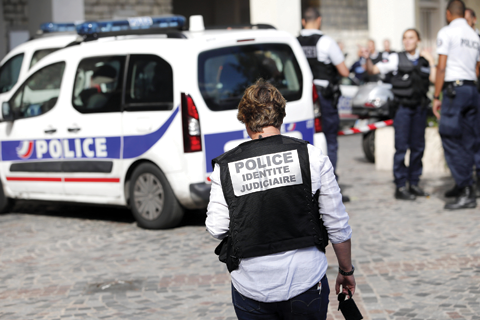 PARIS: French Police work on the scene where French soldiers were hit and injured by a vehicle in the western Paris suburb of Levallois-Perret. —AP
