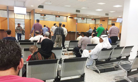 KUWAIT: Some expats are pictured at the Immigration Department. Confusion over incorrect data on work visas has left many expats stranded and unable to travel out of Kuwait for holiday.
