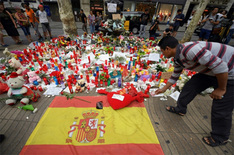 A makeshift memorial to the victims of the Barcelona terror attack on Las Ramblas boulevard - AFP
