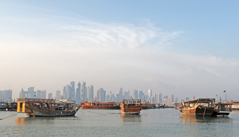 DOHA: A general view shows boats moored in front of the skyline of the Qatari capital, Doha. A Nepalese construction worker in Qatar was ‘sacked’ the day after speaking to a UN delegation visiting the 2022 World Cup host country to examine labor conditions. — AFP