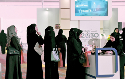 RIYADH: Saudi women apply for a job during Glowork Career Fair 2017 for Saudi women employments held at a hotel in the Saudi capital Riyadh yesterday.-AFP