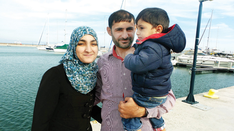   MYTILENE, Greece: In this photograph taken on Oct 23, 2017, Mohamed Alhelb, his wife Nahil and their son Abdur pose at the port of Mytilene on Lesbos Island. - AFP 