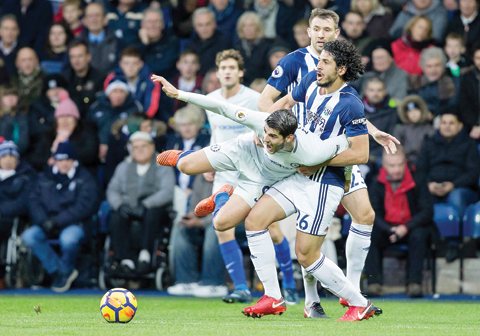 WEST BROMWICH: West Bromwich Albion's Egyptian defender Ahmed Hegazyn(R) vies with Chelsea's Spanish striker Alvaro Morata (C) duringnthe English Premier League football match between West BromwichnAlbion and Chelsea at The Hawthorns stadium. – AFPnnnn