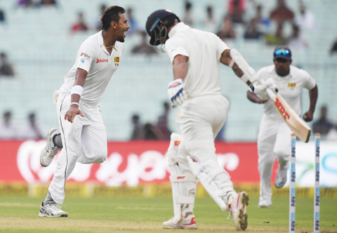 KOLKATA: Sri Lanka’s Suranga Lakmal celebrates after taking the wicket of India’s Shikhar Dhawan during the first day of the first Test between India and Sri Lanka at the Eden Gardens cricket stadium in Kolkata.—AFP